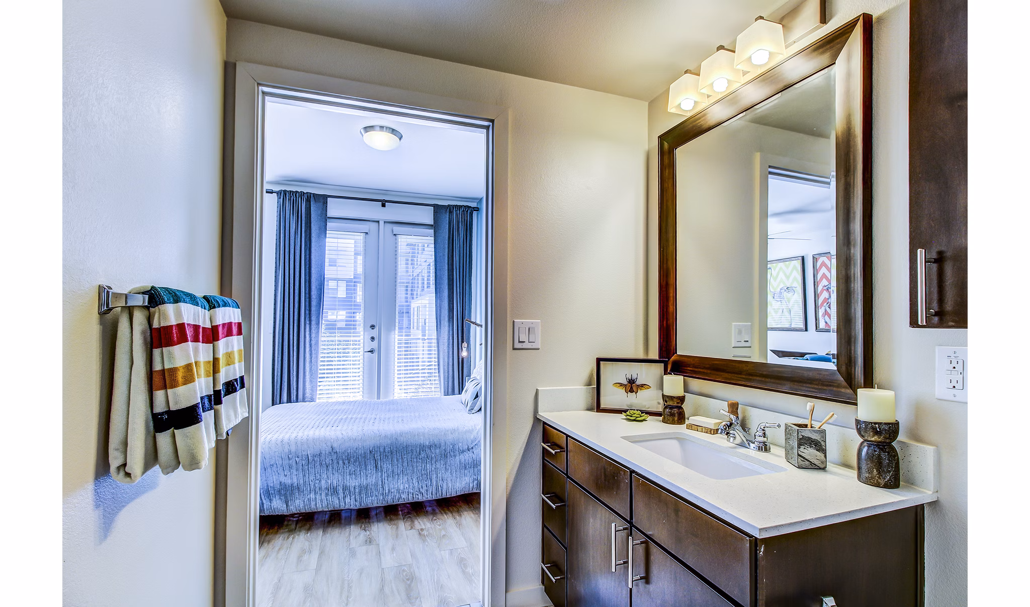 Modern bathroom with sleek fixtures at Elan East Apartments featuring marble countertops and spacious layout