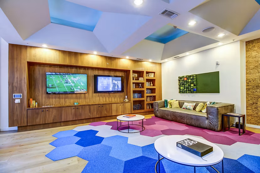 Lobby with sleek seating and modern decor at Elan East Apartments, a luxury clubhouse perfect for relaxation and social gatherings