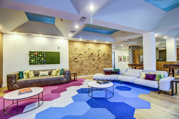 Clubhouse lobby featuring modern design and lounge seating at Elan East Apartments