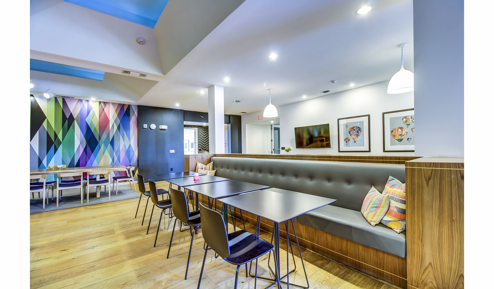 Clubhouse lobby with modern seating and vibrant decor at Elan East Apartments in Austin, TX