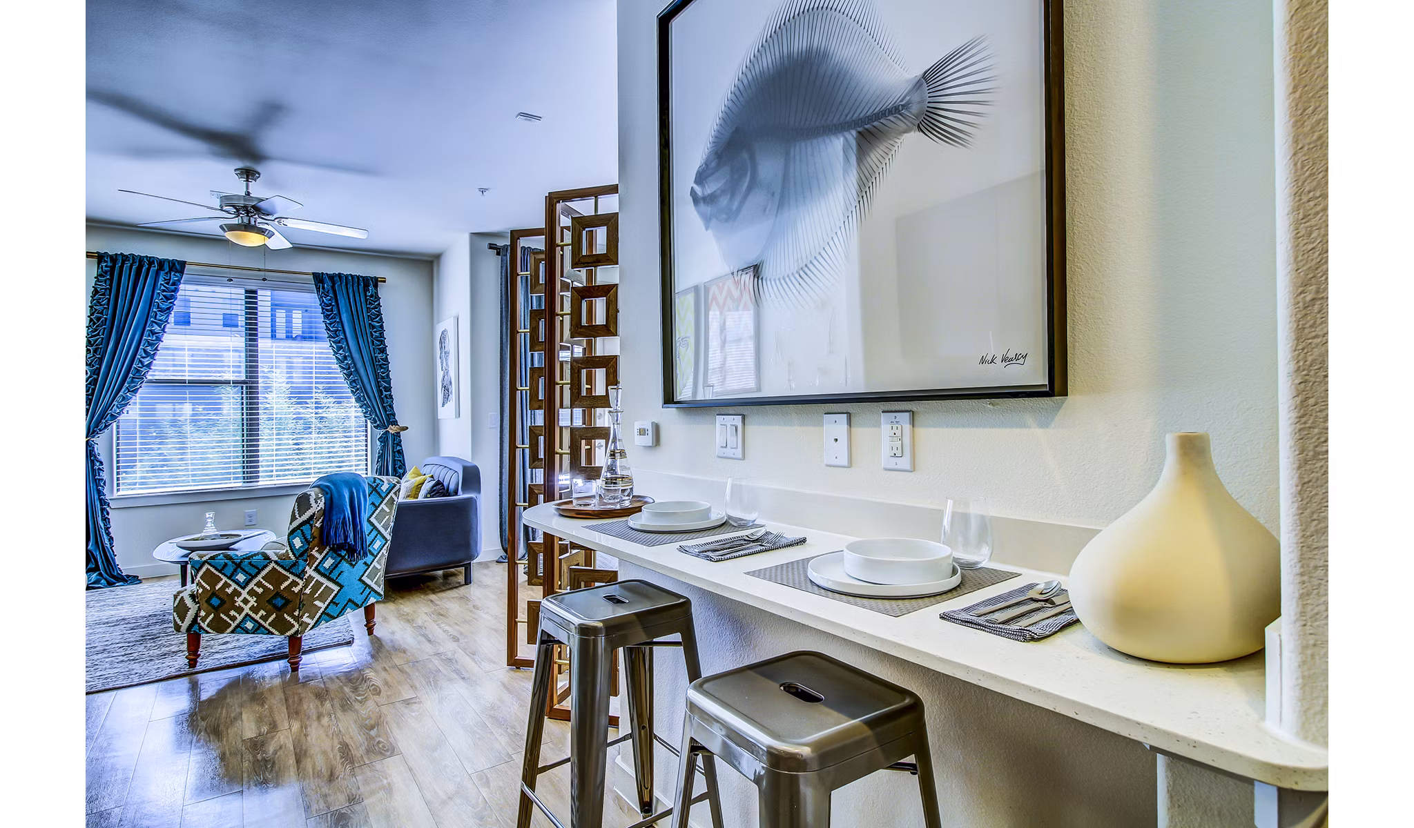 Dining room with sleek modern decor at Elan East Apartments, showcasing luxury living in a contemporary setting