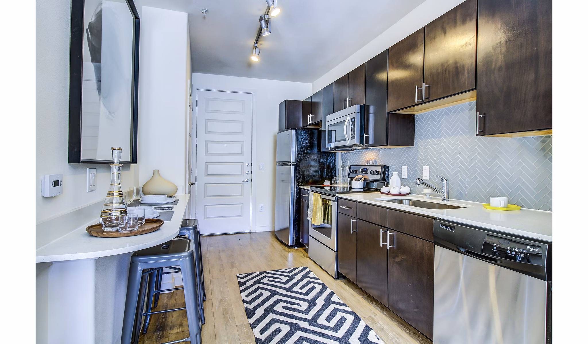 Modern kitchen with stainless steel appliances at Elan East Apartments