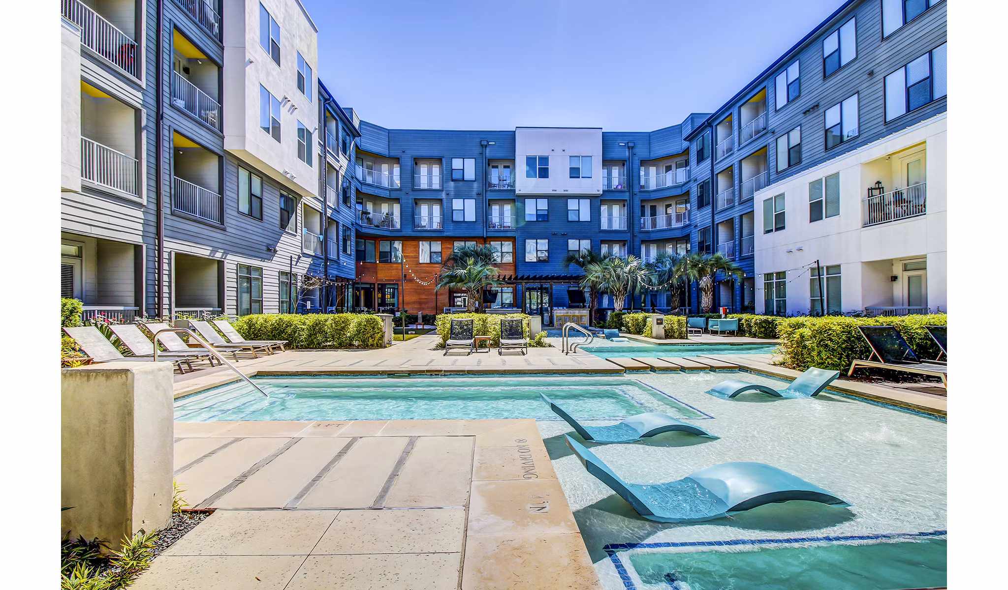 Resort-style swimming pool at Elan East Apartments offering a luxurious outdoor retreat for residents