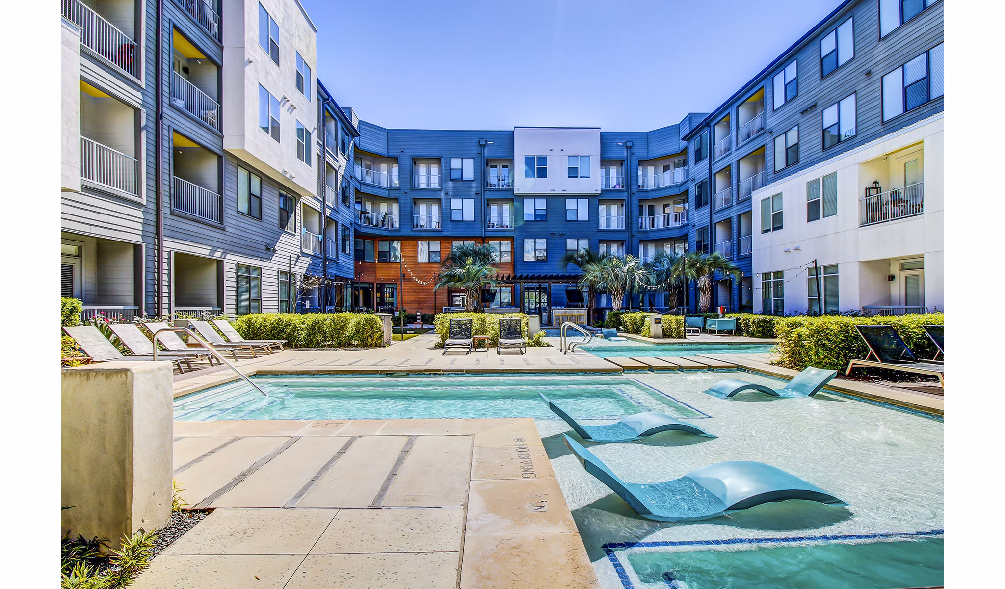 Resort-style swimming pool at Elan East Apartments offering a luxurious outdoor retreat for residents