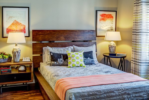Spacious bedroom with modern decor at Coldwater Luxury Apartments