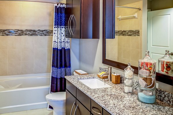 Elegant bathroom with marble finishes at Coldwater Luxury Apartments