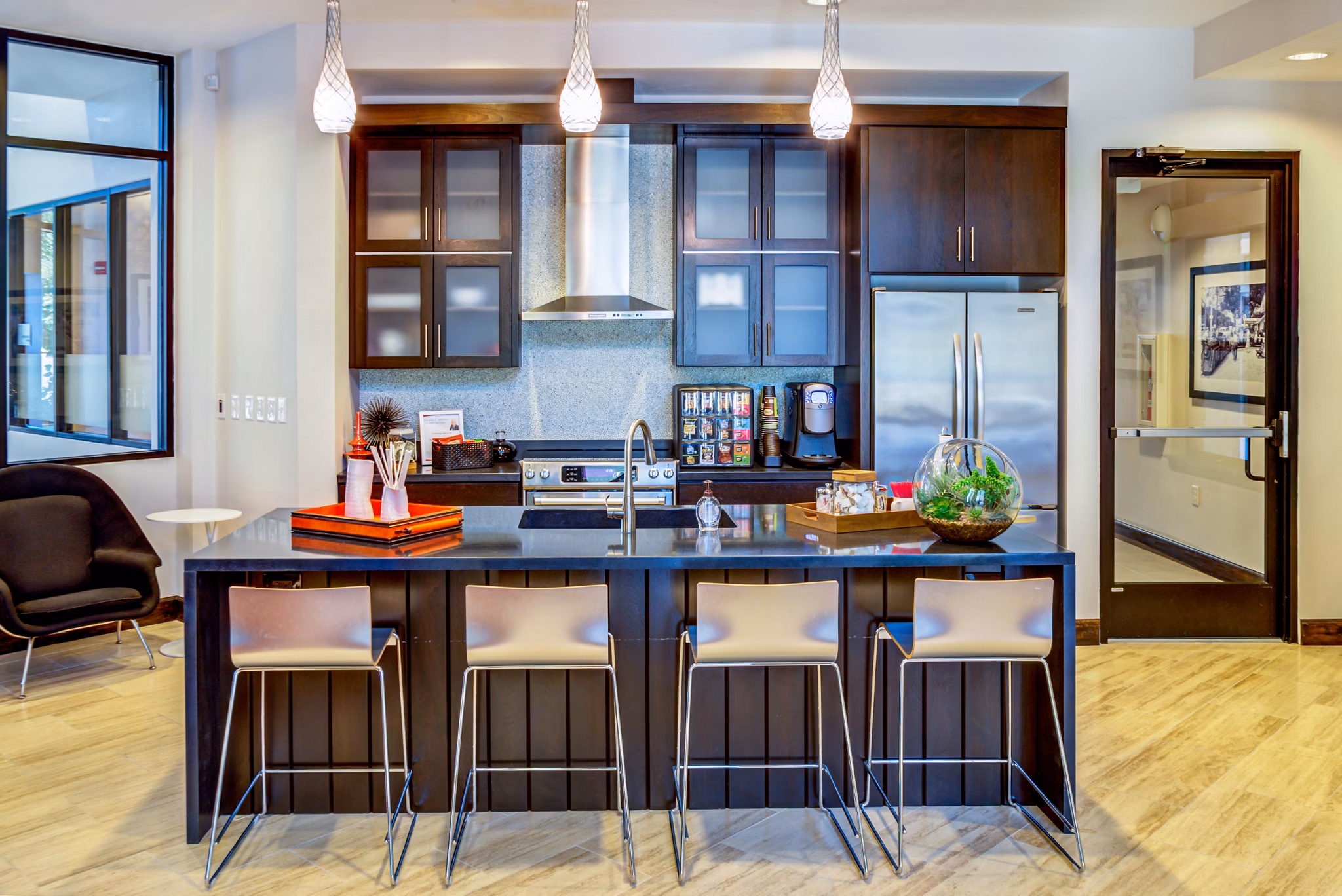 Clubhouse featuring modern lounge seating and entertainment options at Coldwater Luxury Apartments in Greystar community