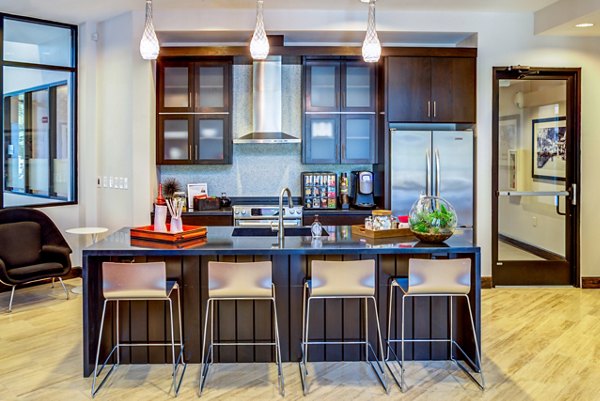 Clubhouse featuring modern lounge seating and entertainment options at Coldwater Luxury Apartments in Greystar community