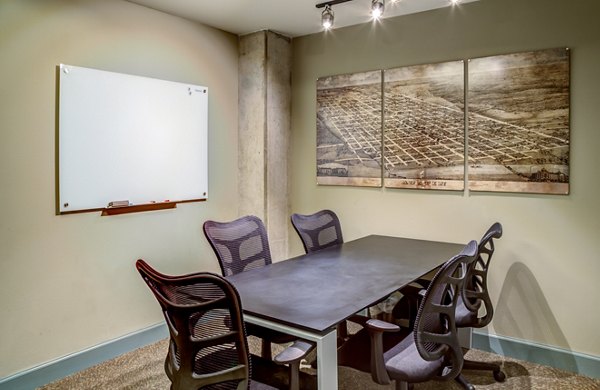 Modern clubhouse with cozy seating at Coldwater Luxury Apartments in upscale neighborhood
