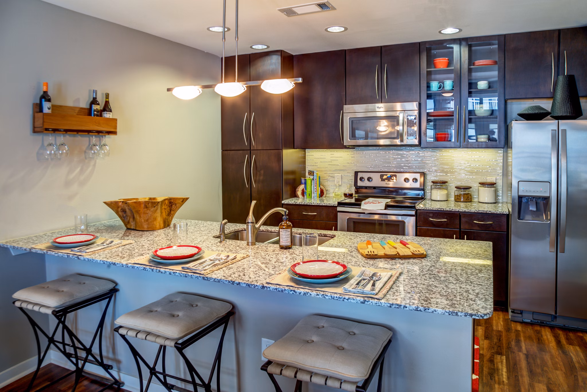 Modern kitchen with sleek appliances and quartz countertops at Coldwater Luxury Apartments