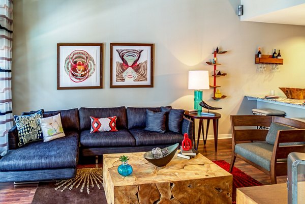 Spacious living room with modern decor in Coldwater Luxury Apartments