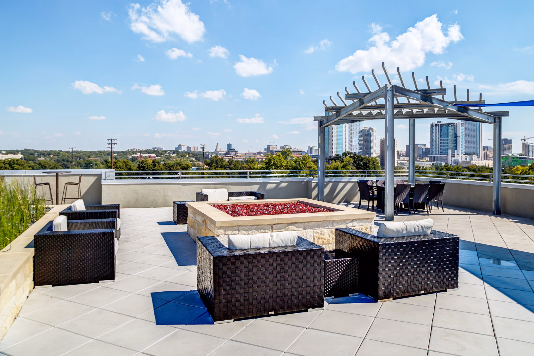 Outdoor fire pit gathering area at Coldwater Luxury Apartments