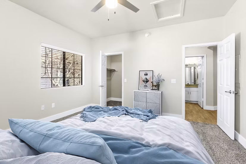 Cozy bedroom featuring modern decor at Fountain Palms Apartments