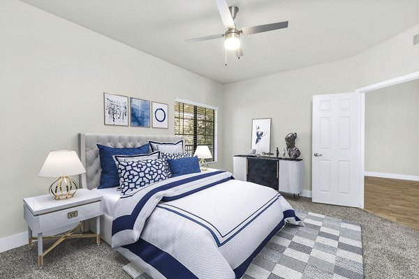 Spacious bedroom with modern decor at Fountain Palms Apartments