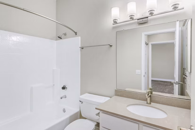 Spacious bathroom with modern fixtures at Fountain Palms Apartments in sunny location