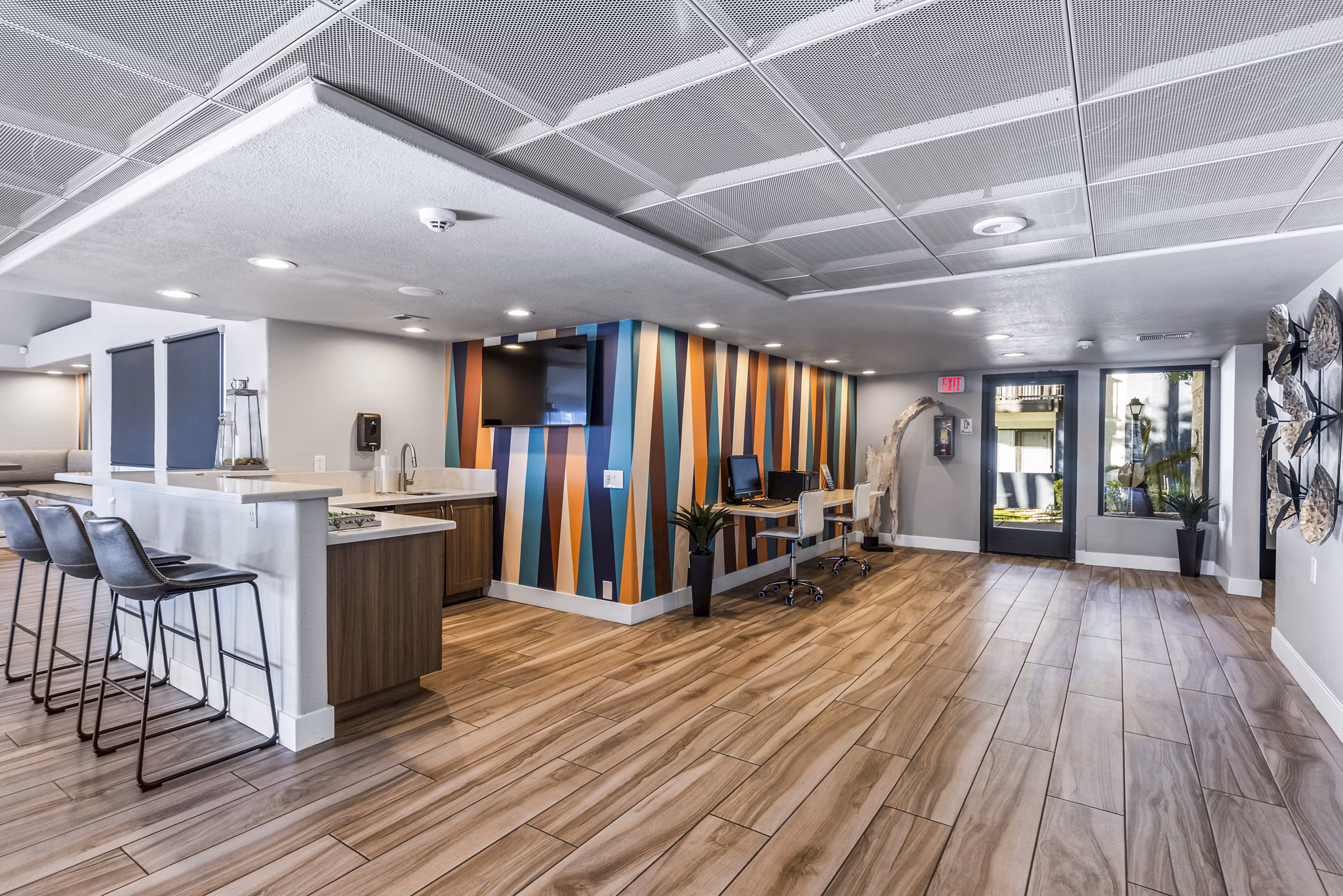 Clubhouse featuring modern decor and seating at Fountain Palms Apartments