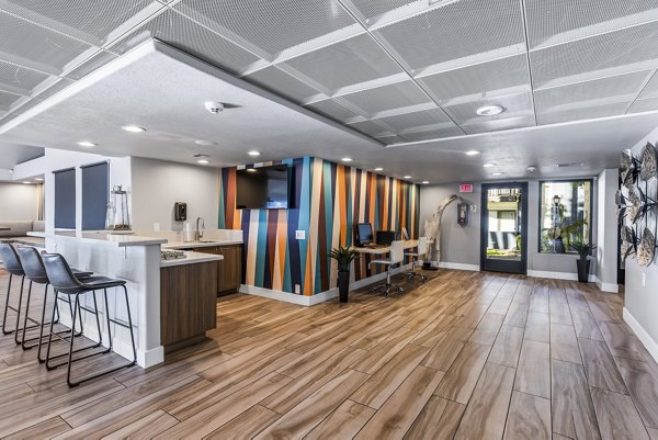 Clubhouse featuring modern decor and seating at Fountain Palms Apartments
