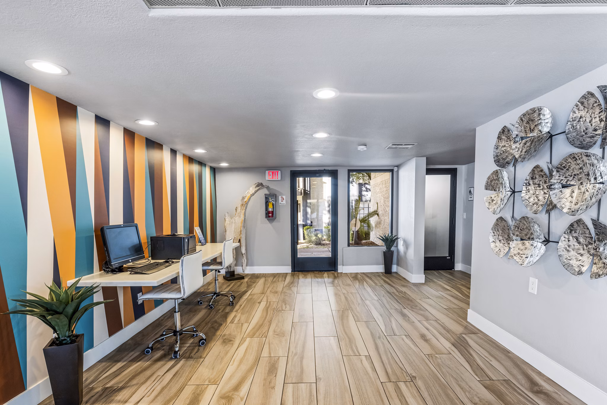 Clubhouse business center with modern amenities at Fountain Palms Apartments, ideal for productivity-enhancing workspaces