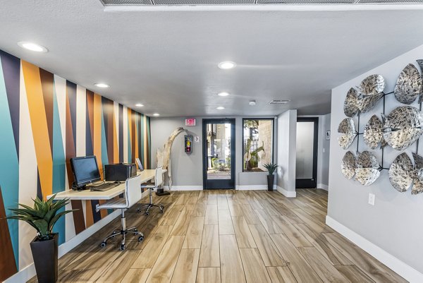 Clubhouse business center with modern amenities at Fountain Palms Apartments, ideal for productivity-enhancing workspaces