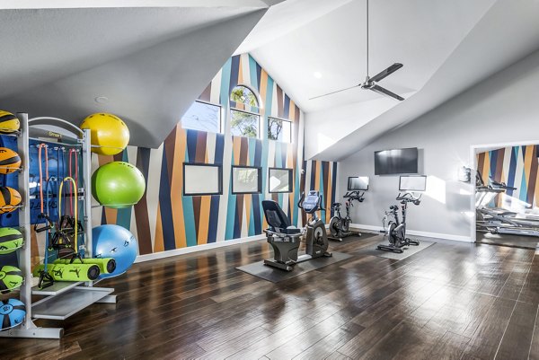 Modern fitness center featuring state-of-the-art equipment at Fountain Palms Apartments