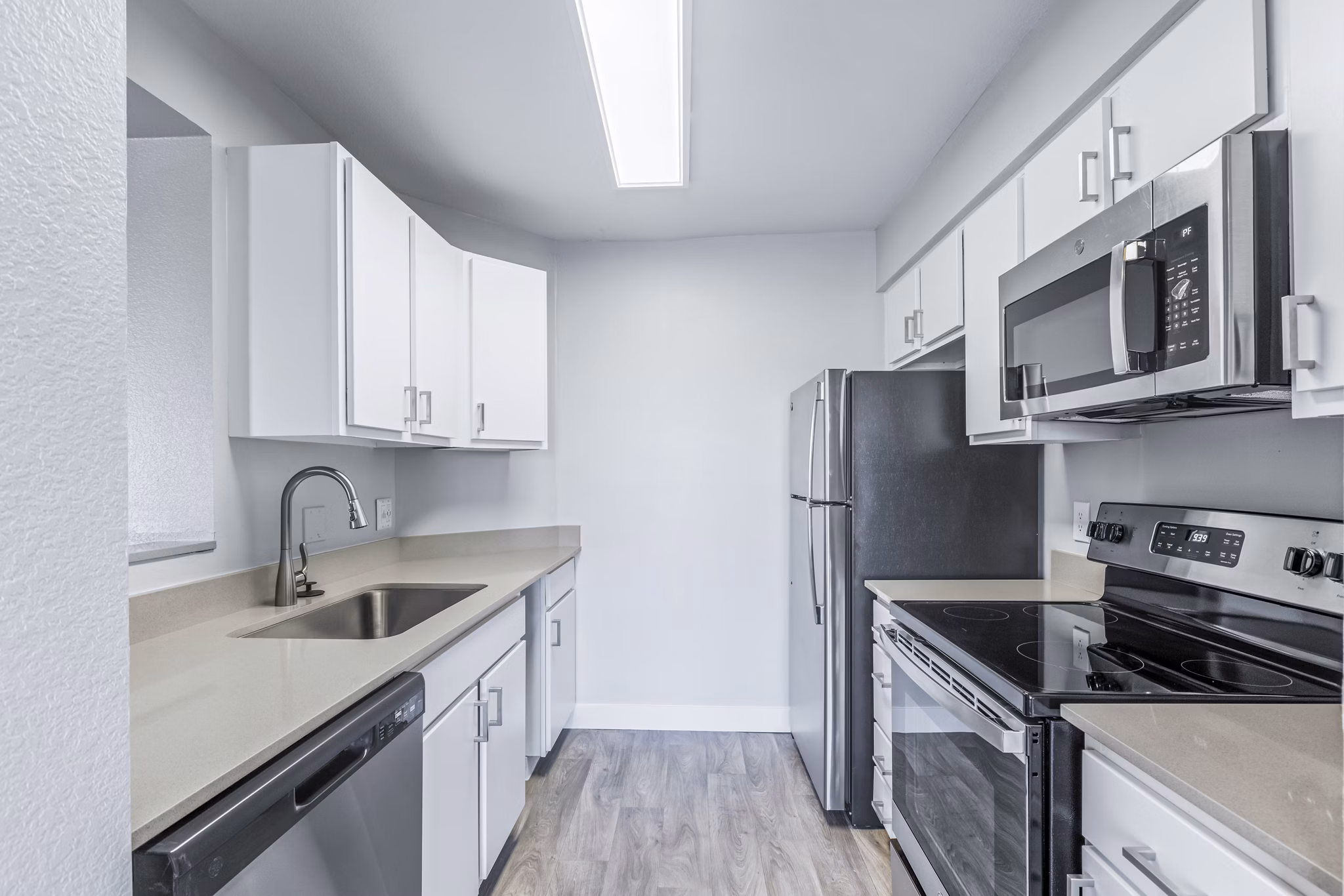 Modern kitchen with stainless steel appliances at Fountain Palms Apartments
