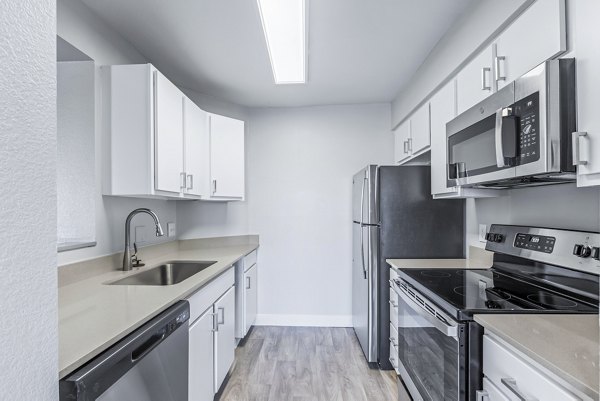 Modern kitchen with stainless steel appliances at Fountain Palms Apartments
