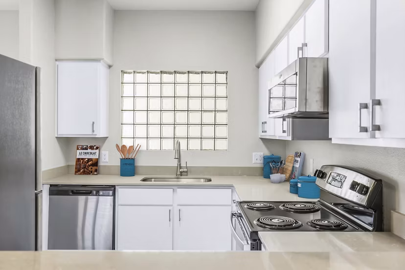 Modern kitchen featuring stainless steel appliances at Fountain Palms Apartments