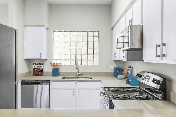 Modern kitchen featuring stainless steel appliances at Fountain Palms Apartments