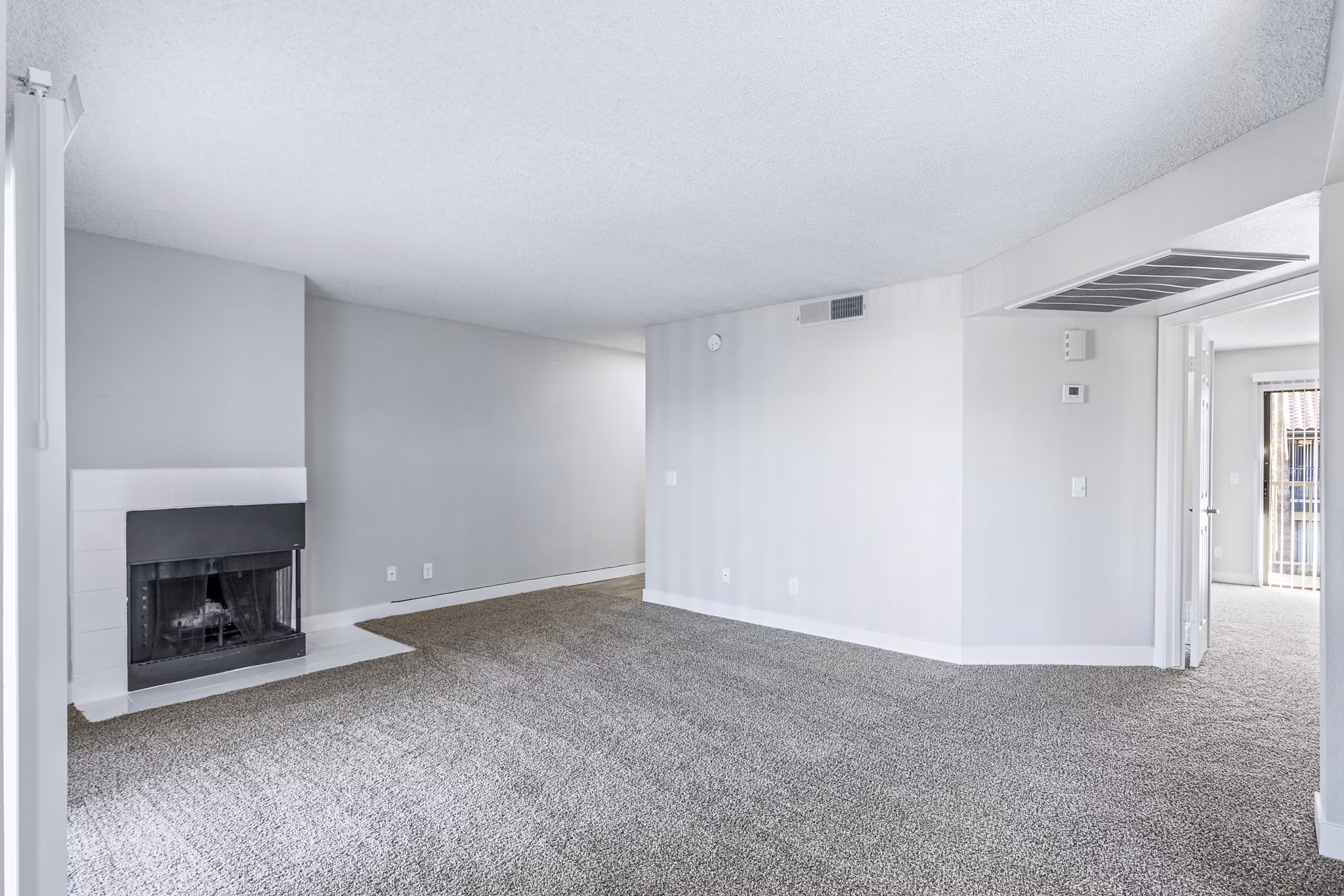 Spacious living room with modern decor in Fountain Palms Apartments offering luxury living in a prime location