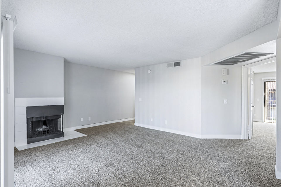 Spacious living room with modern decor in Fountain Palms Apartments offering luxury living in a prime location
