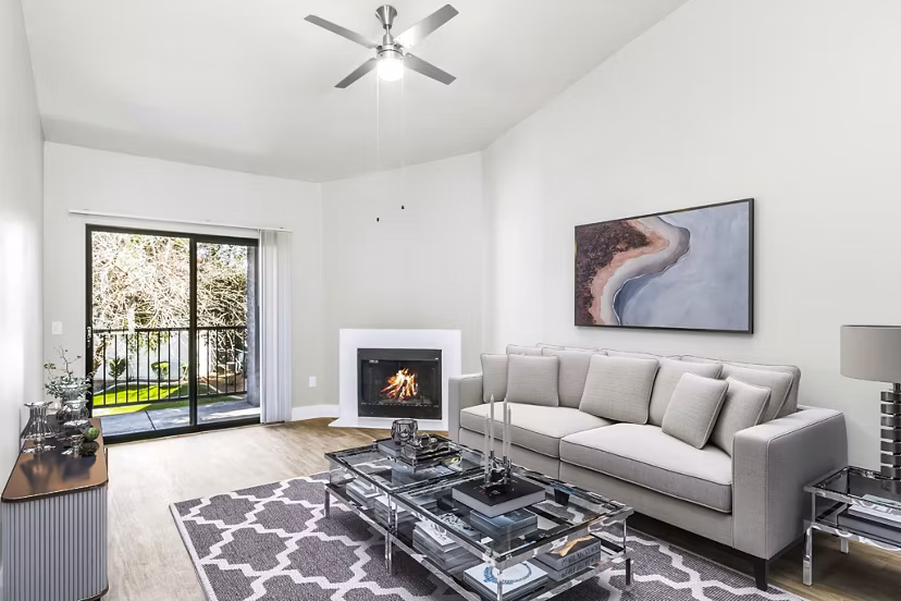 Modern living room with plush seating and natural light at Fountain Palms Apartments, a luxury community in a prime location