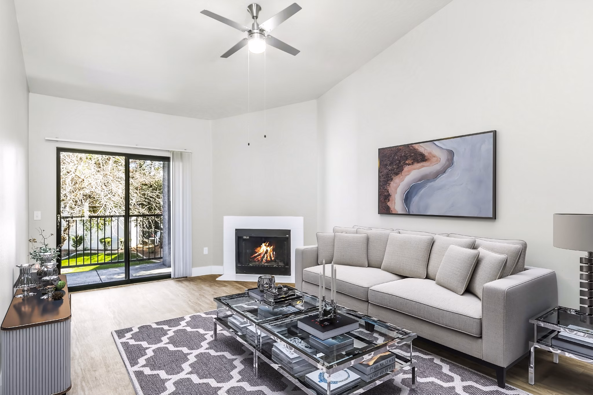 Modern living room with plush seating and natural light at Fountain Palms Apartments, a luxury community in a prime location