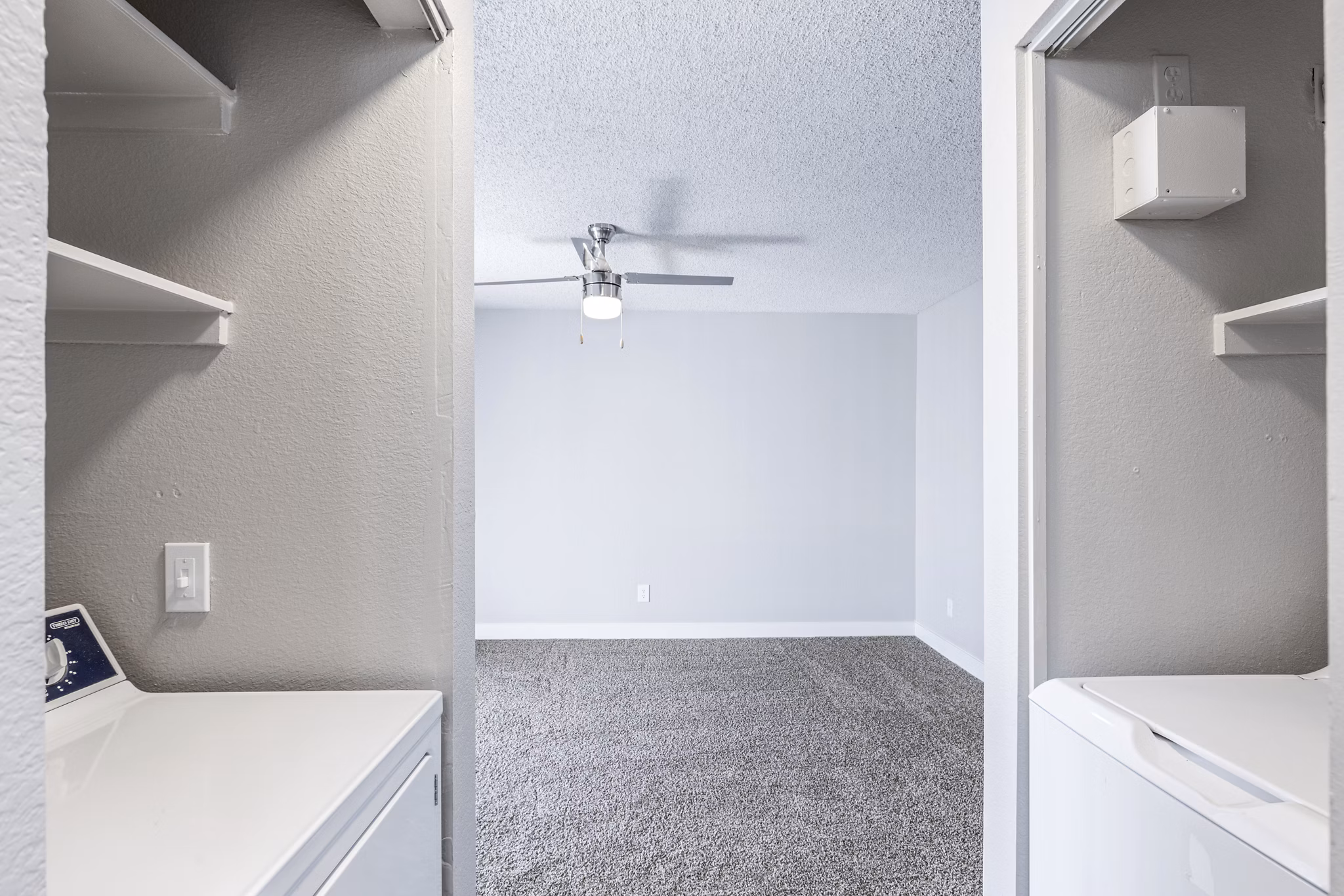 Laundry room with energy-efficient washers and dryers at Fountain Palms Apartments, a luxury Greystar community in Phoenix
