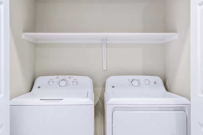 Laundry room with modern appliances at Fountain Palms, Greystar luxury apartments in Phoenix