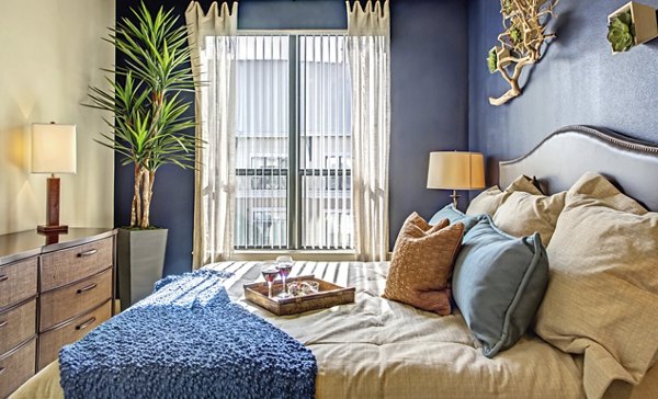 Modern bedroom with stylish furnishings at Sawyer Heights Lofts Luxury Apartments in Houston