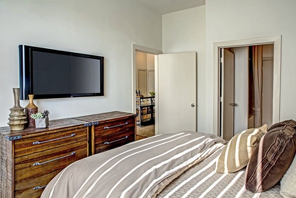 Bright bedroom with modern decor at Sawyer Heights Lofts Luxury Apartments