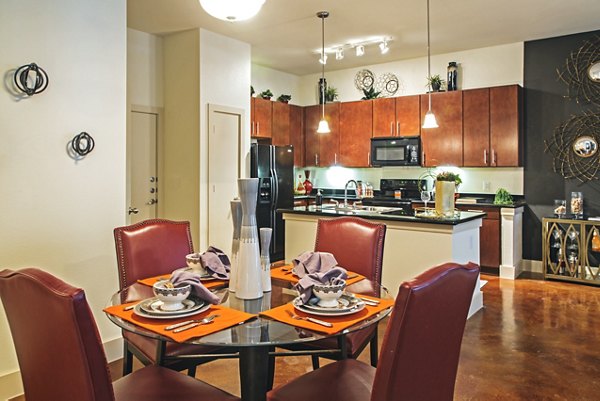 Dining room with modern decor and elegant lighting at Sawyer Heights Lofts Luxury Apartments