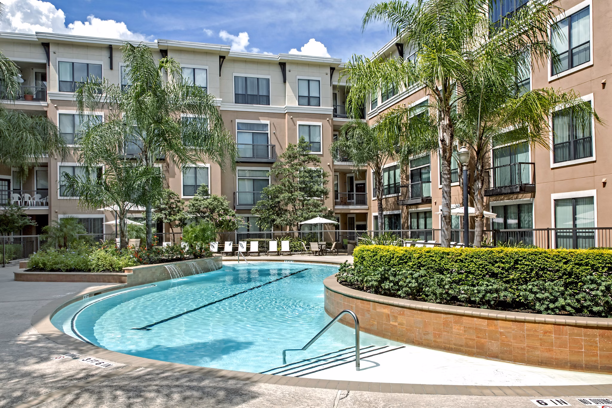 Rooftop pool with skyline views at Sawyer Heights Lofts Luxury Apartments in Houston