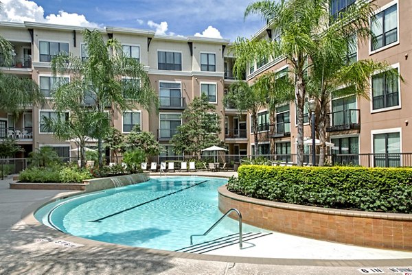 Rooftop pool with skyline views at Sawyer Heights Lofts Luxury Apartments in Houston
