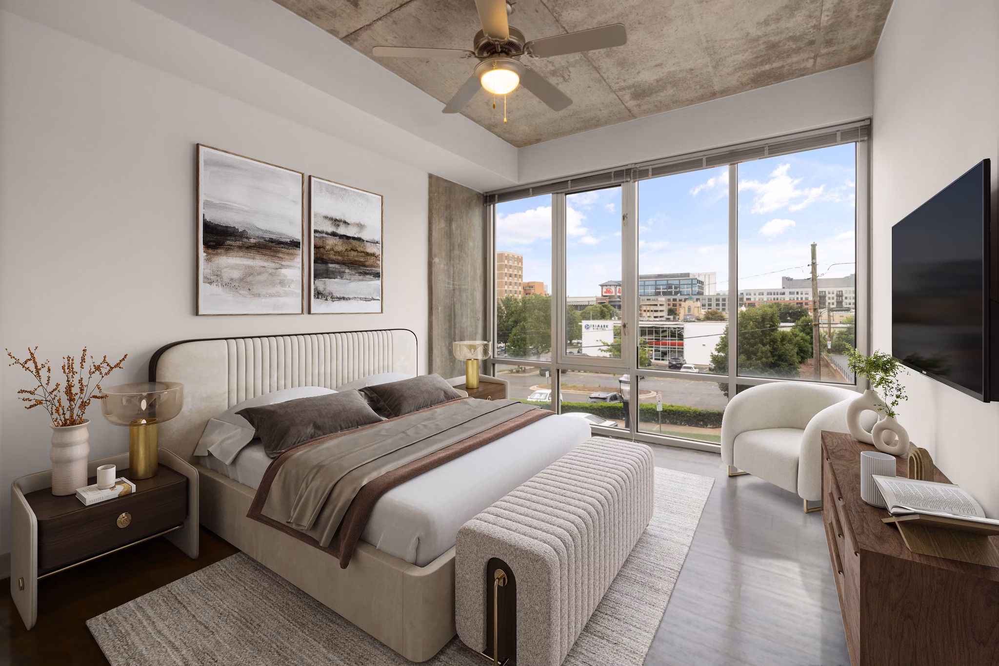 Cozy bedroom with contemporary design at The Devon Four25 Apartments, featuring luxurious bedding and ample natural light for a modern living experience