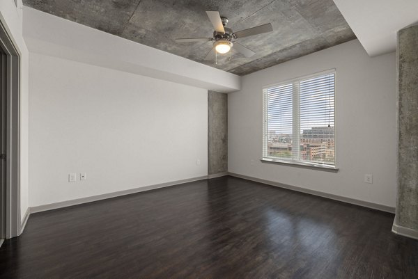 Modern bedroom with skyline views at The Devon Four25 Apartments