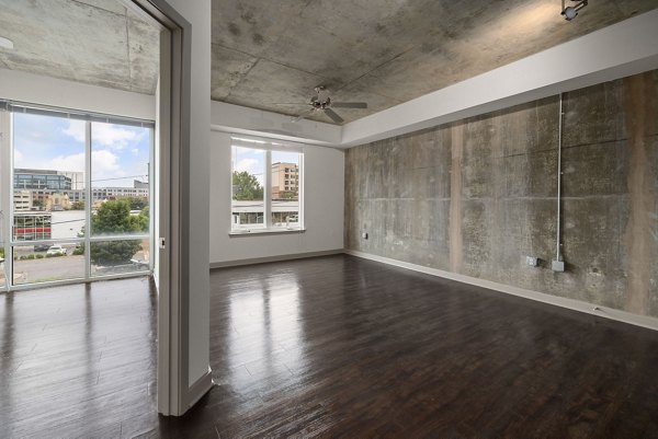 Spacious bedroom with modern decor at The Devon Four25 Apartments