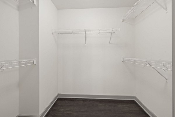 Spacious closet with ample shelving in a luxury bedroom at The Devon Four25 Apartments