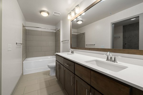 Modern bathroom with sleek fixtures at The Devon Four25 Apartments, offering luxury living in downtown Raleigh, NC.