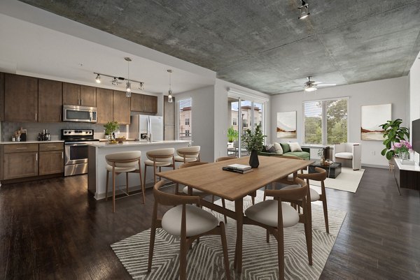 Dining room featuring elegant seating and modern lighting at The Devon Four25 Apartments