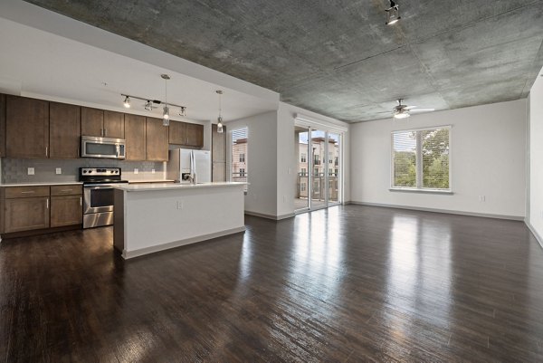 Spacious living room with modern furnishings at The Devon Four25 Apartments