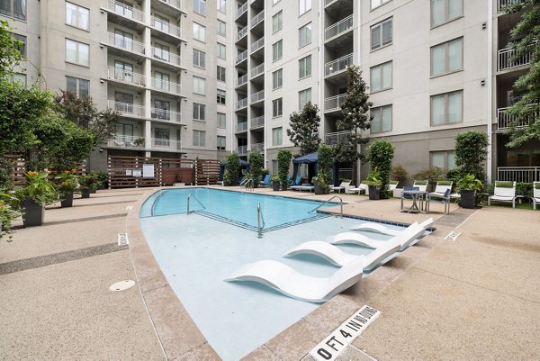 Rooftop pool with skyline views at The Devon Four25 Apartments