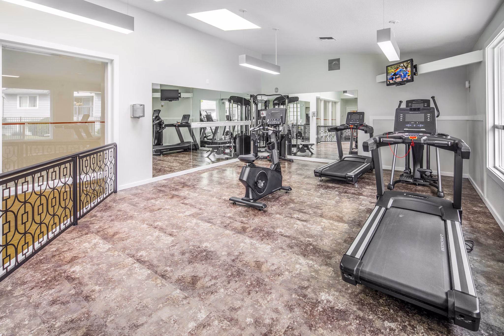 Modern fitness center with advanced equipment at Avana at Happy Valley Apartments, offering residents luxury workout options