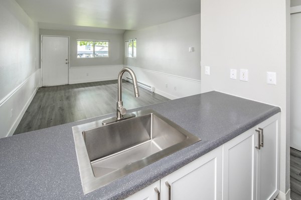 Modern kitchen with stainless steel appliances at Avana at Happy Valley Apartments, a luxury living space by Greystar