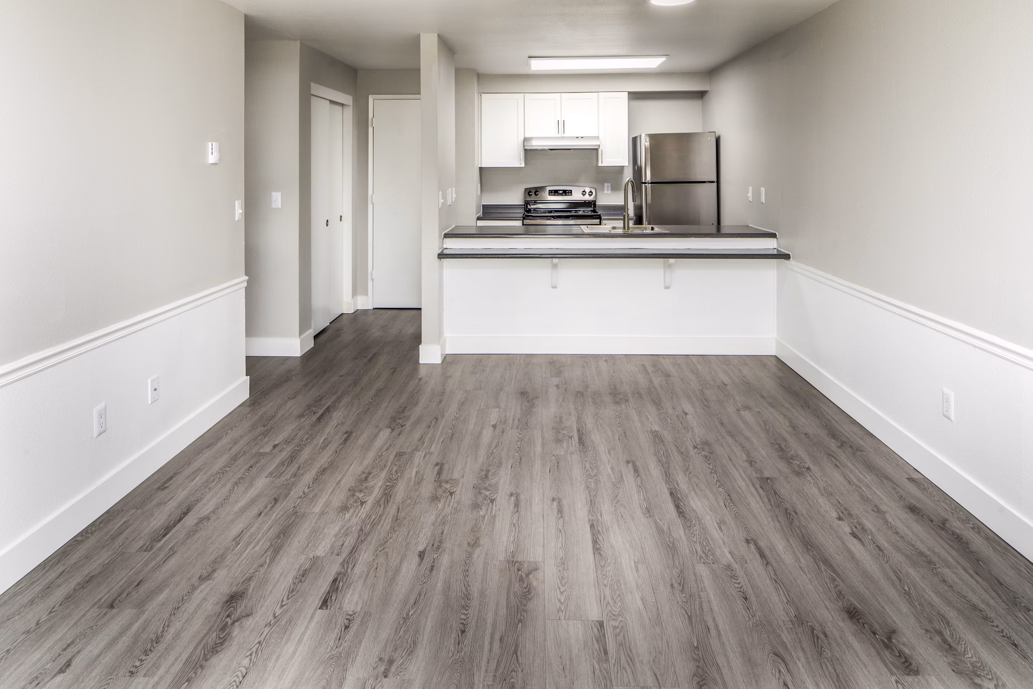 Spacious living room with modern furnishings at Avana at Happy Valley Apartments